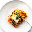 One prepared keto egg lasagna roll up served on a plate