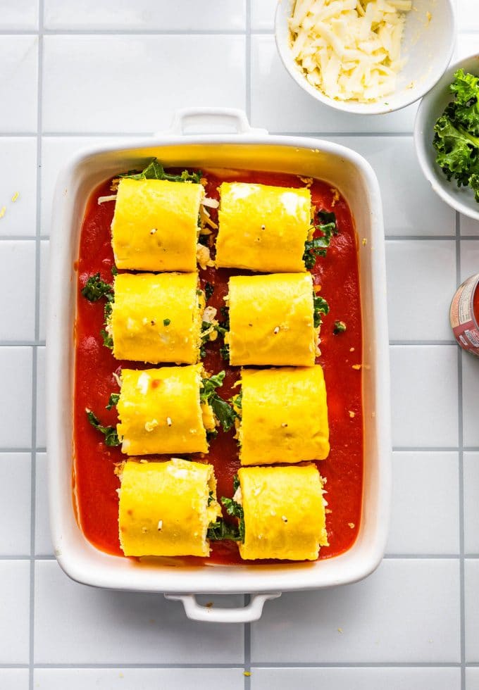 Image of casserole dish filled with lasagna roll-ups prior to baking in the oven.