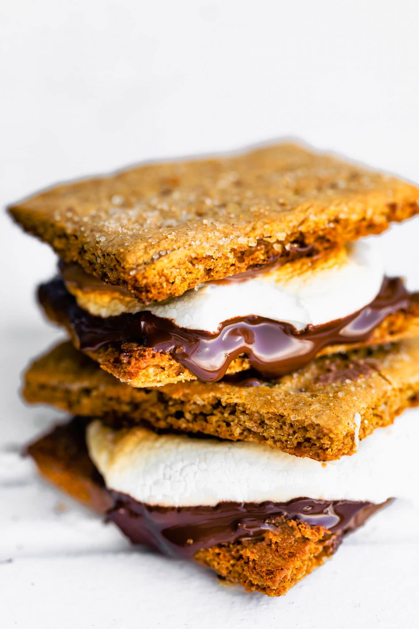 Close up image of gluten free smores with melted homemade marshmallows and chocolate.