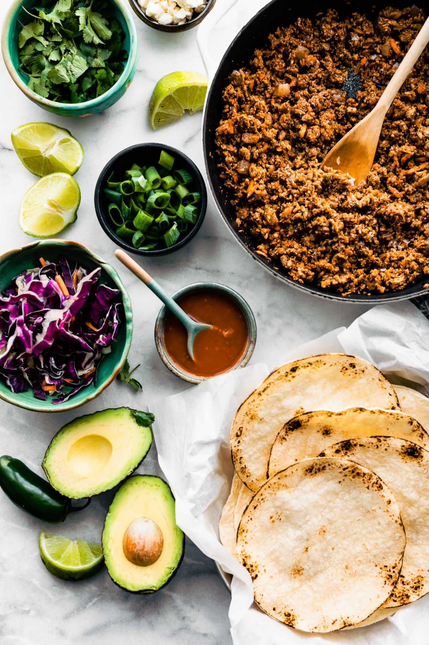 Vegan taco meat with tortillas and fixings.