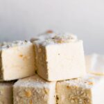 A close up image of stacked homemade coconut marshmallows.