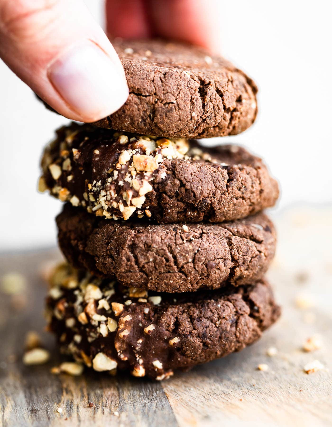 Close up image of stack of chocolate hazelnut cookies.