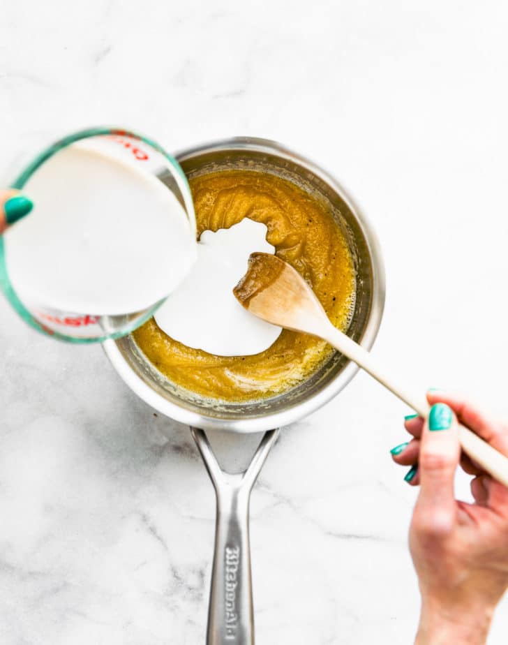 Easy Vegan Cheese Sauce being made from a gluten free roux