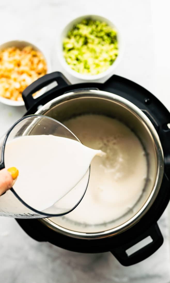 milk being poured into an instant pot