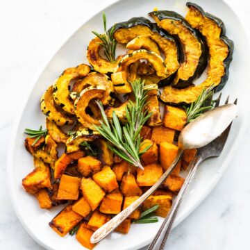 Roasted acorn, delicata, and butternut squash on a serving platter