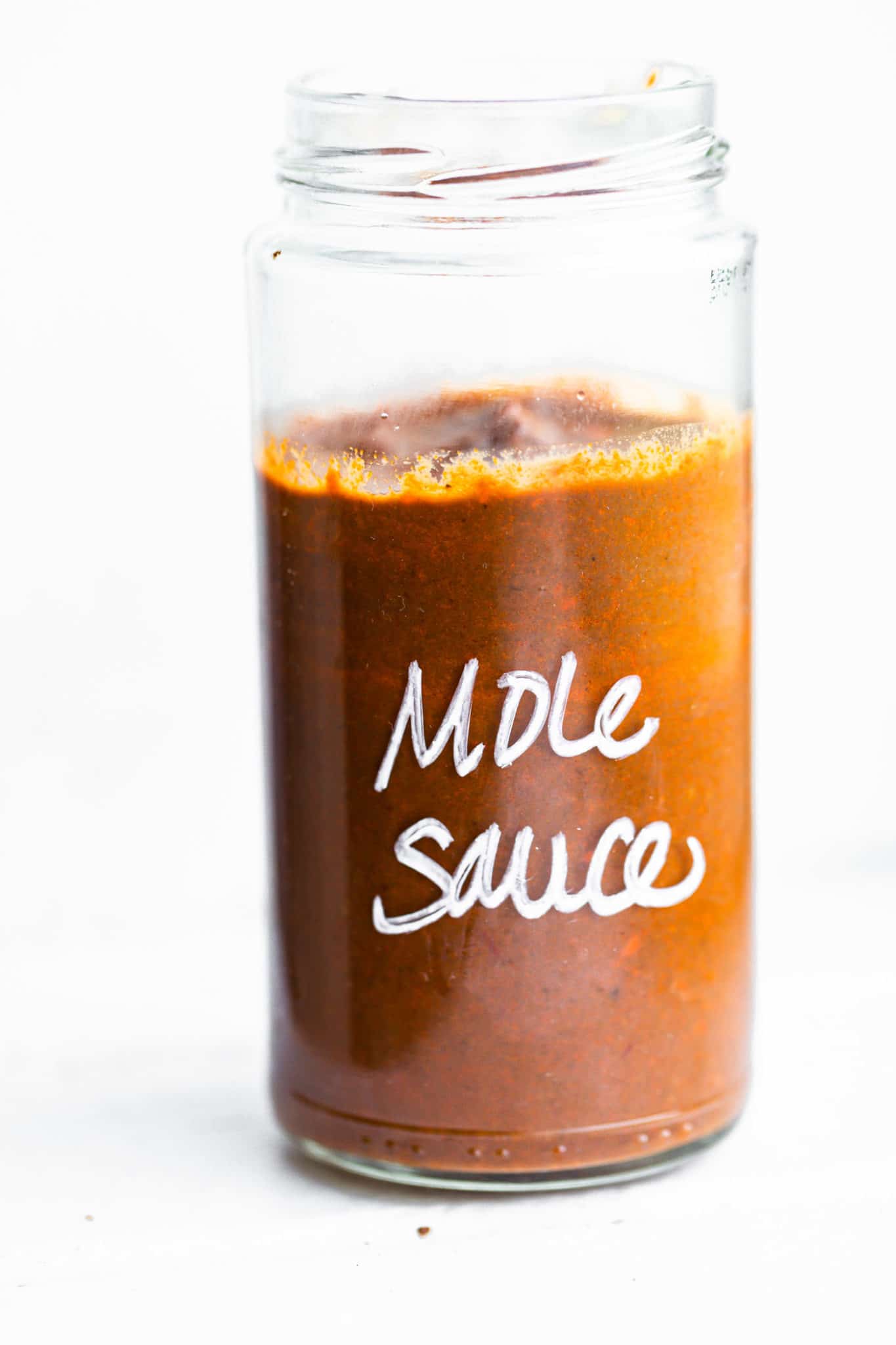 Homemade mole sauce in a glass jar
