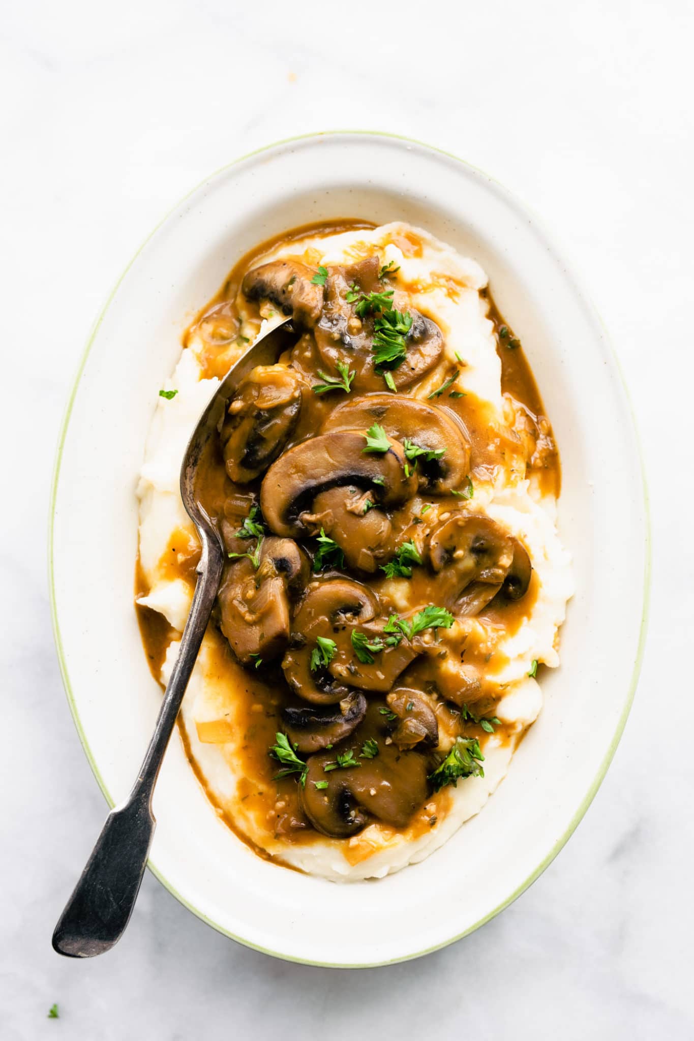 vegan mushroom gravy on top of dairy free mashed potatoes