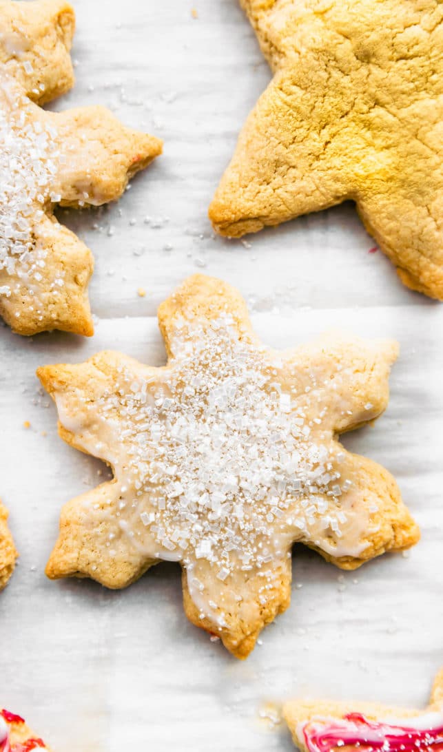 Close up view of a star shaped gluten free sugar cookie cut out with sparkling glitter crystals on top