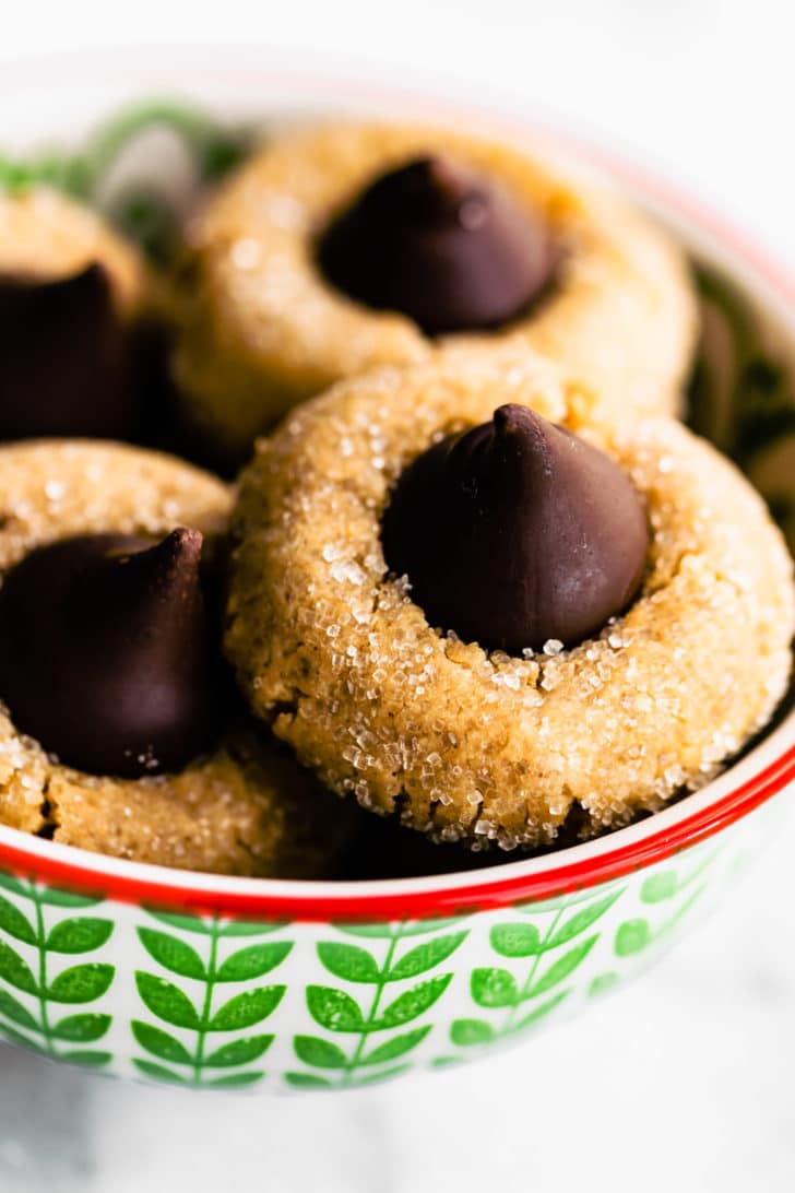close up image of peanut butter blossom cookies in a bowl