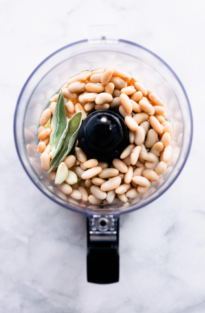 Cannellini beans with fresh herbs in a food processor