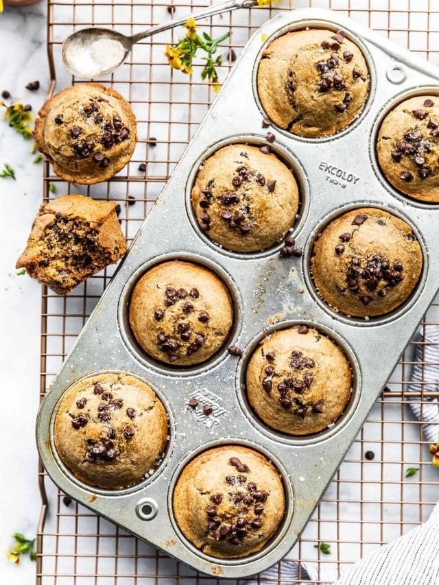 Overhead view of flourless chocolate chip protein muffins in a muffin tin.