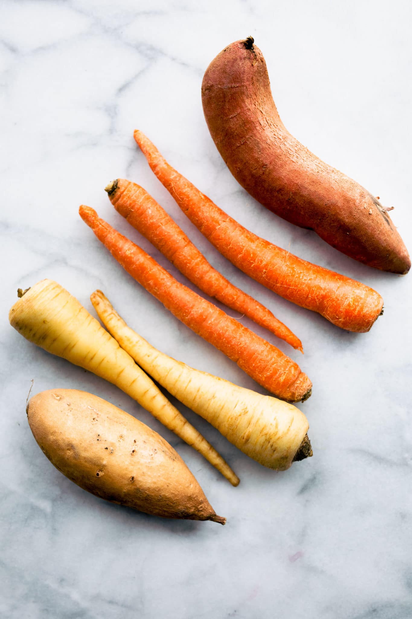 a sweet potato, three carrots, two parsnips, and a yam