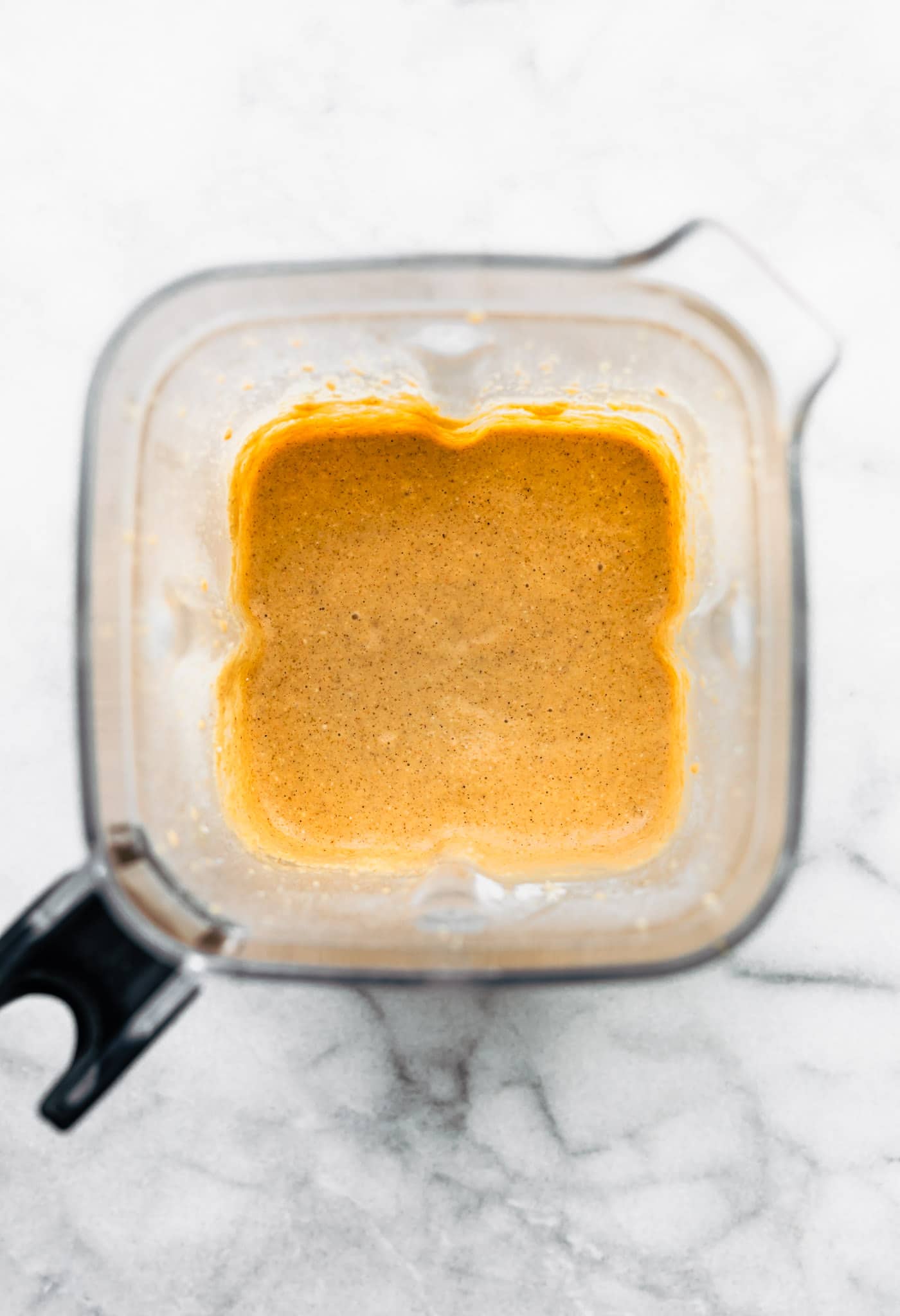 overheat image of a blender containing mixed batter for healthy carrot cake muffins