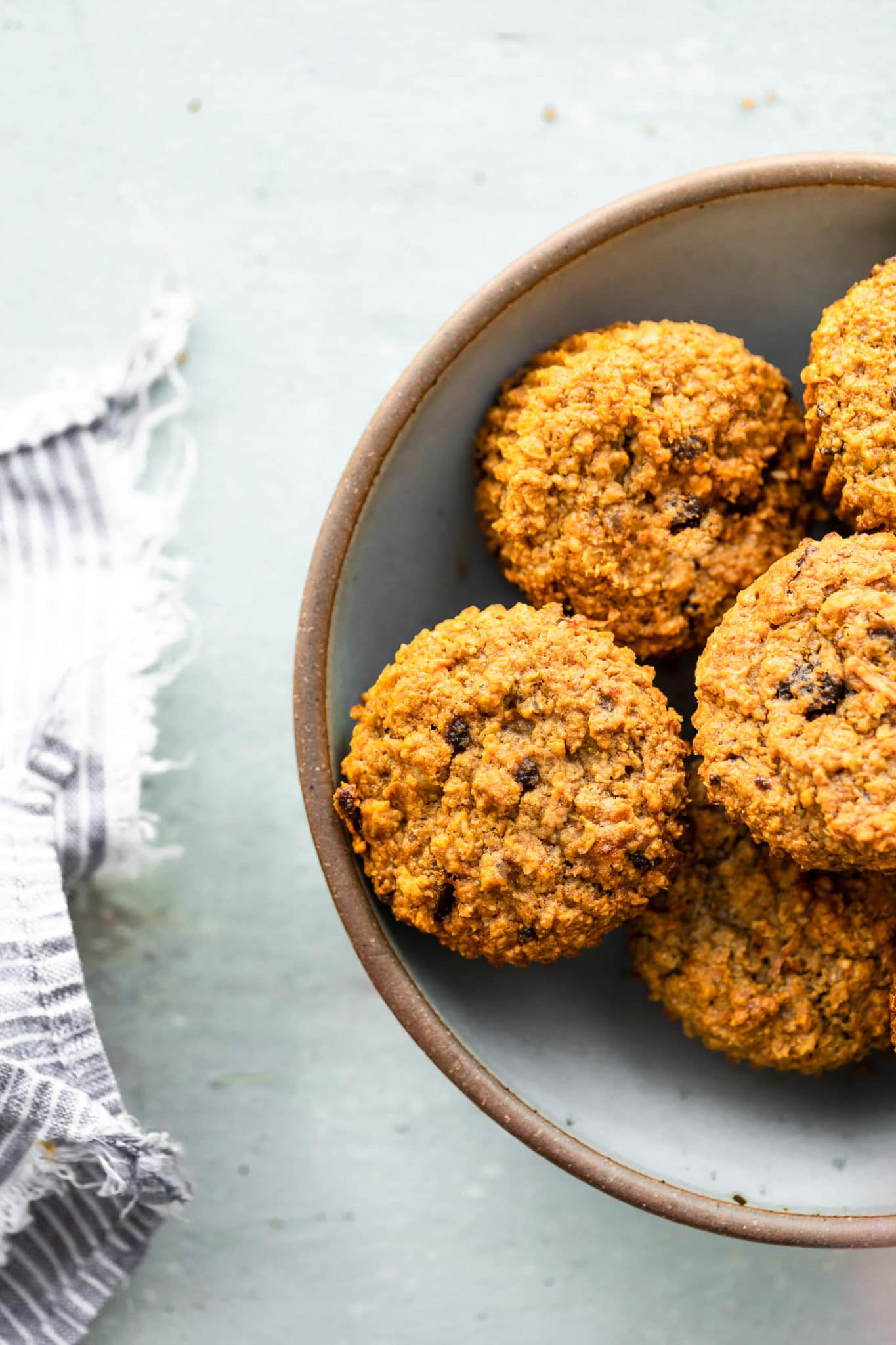 overhead image of easy healthy carrot cake muffins in a white bowl