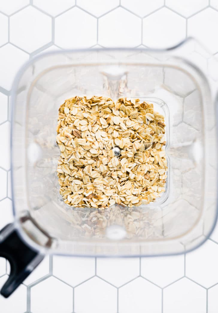 overhead image of raw gluten free oats in a blender