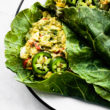 close up image of Mexican avocado egg salad wraps in collard greens