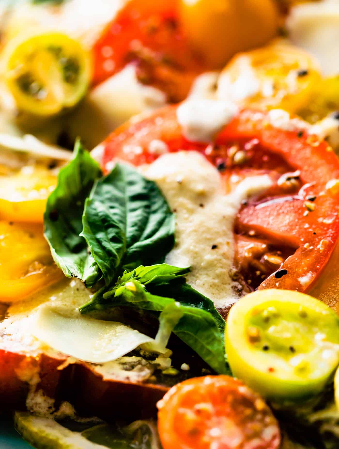 close up image of a Caesar style tomato salad recipe