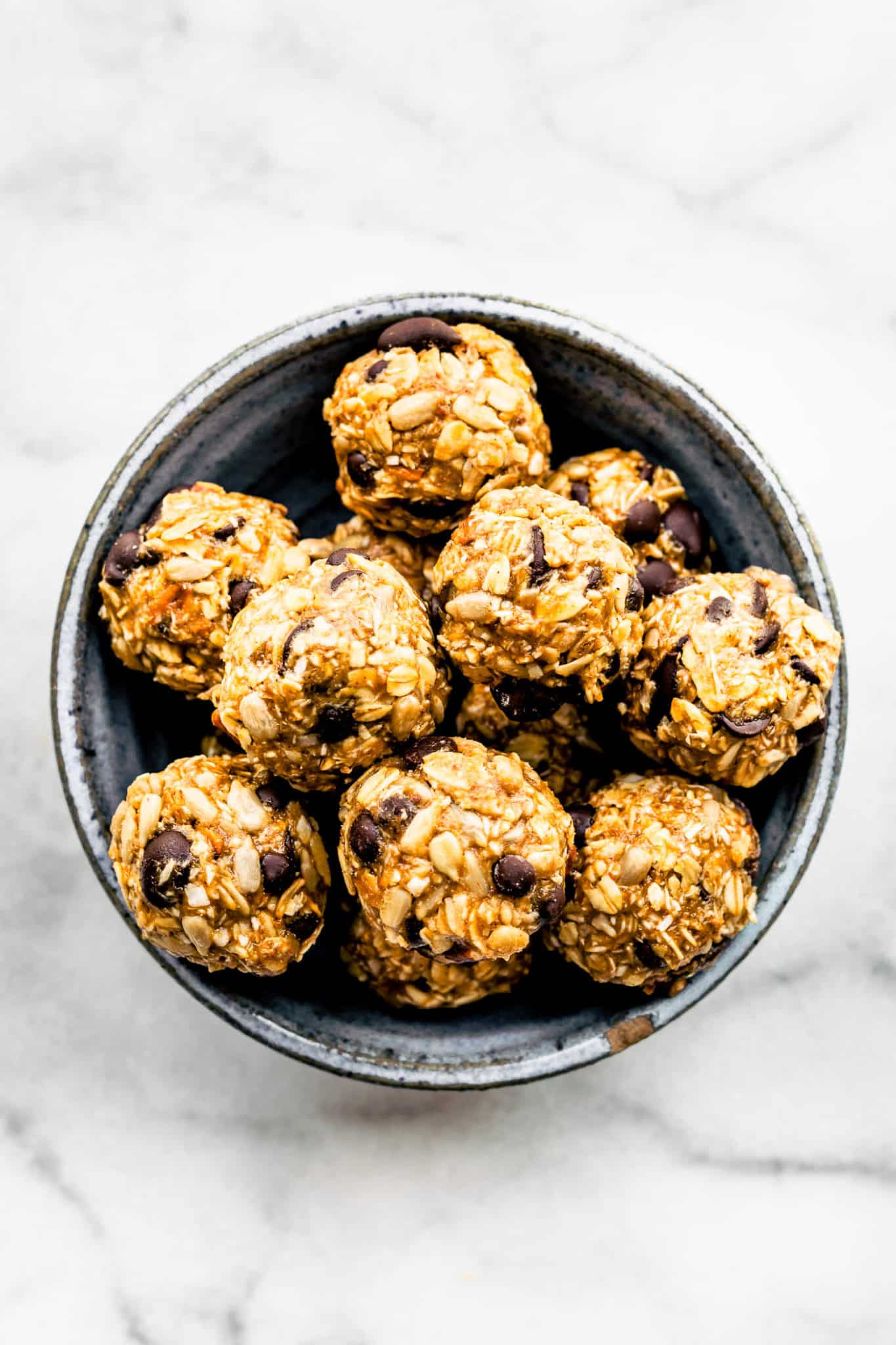a bowl full of no bake cowboy cookie energy bites
