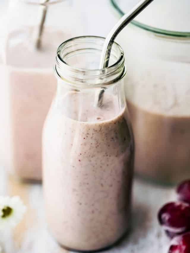 glass jar filled with frozen grape smoothie