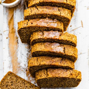 overhead image of a sliced loaf of gluten free cinnamon almond flour bread