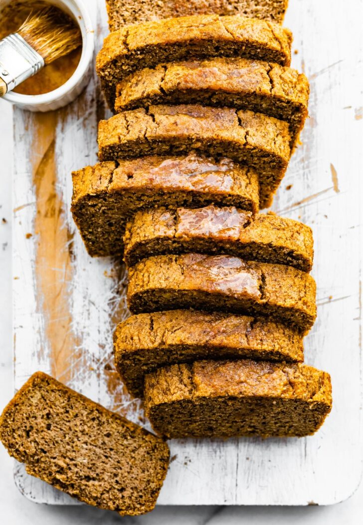 overhead image of a sliced loaf of gluten-free cinnamon almond flour bread