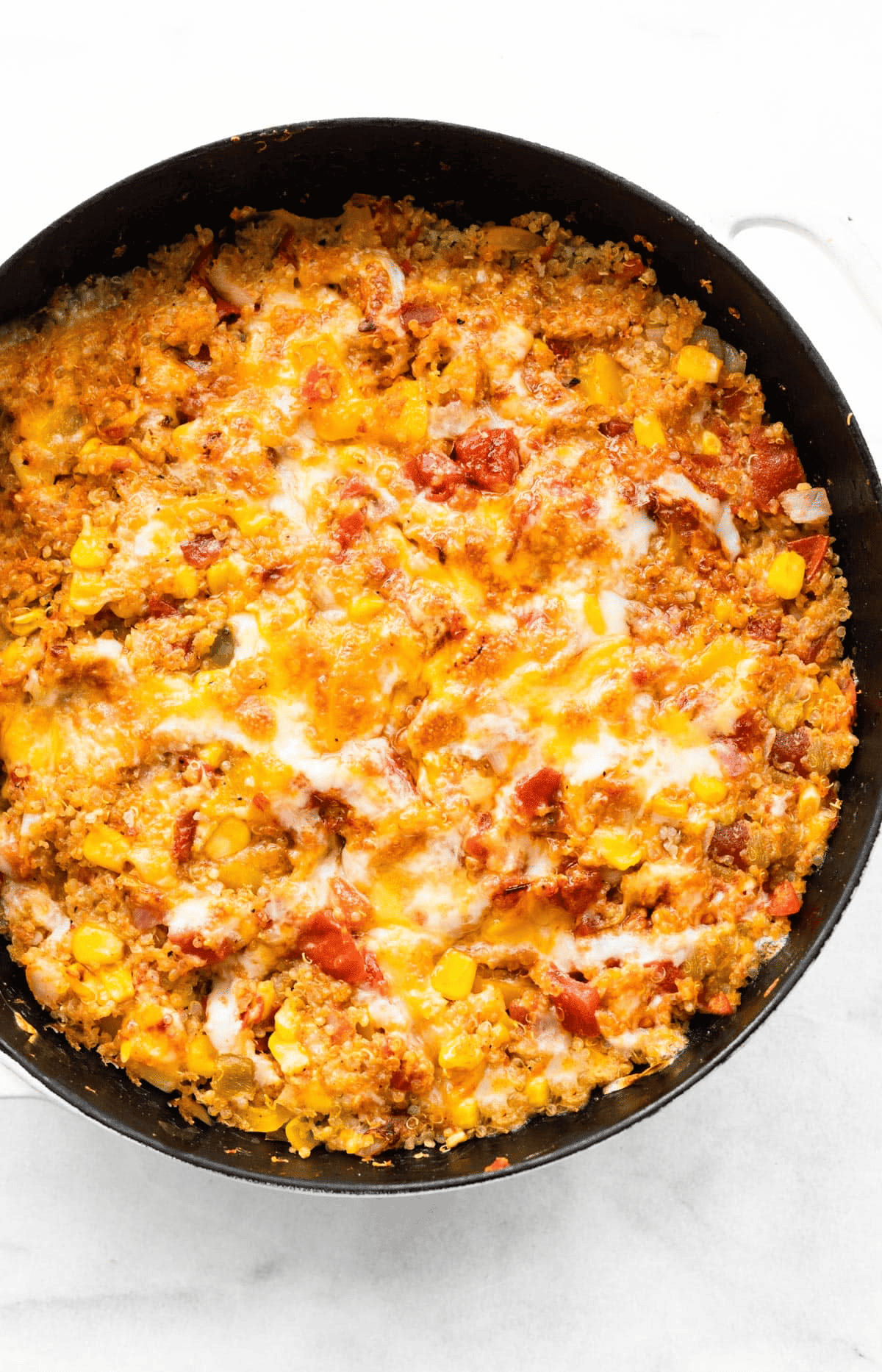 overhead image of Mexican quinoa topped with melted cheese