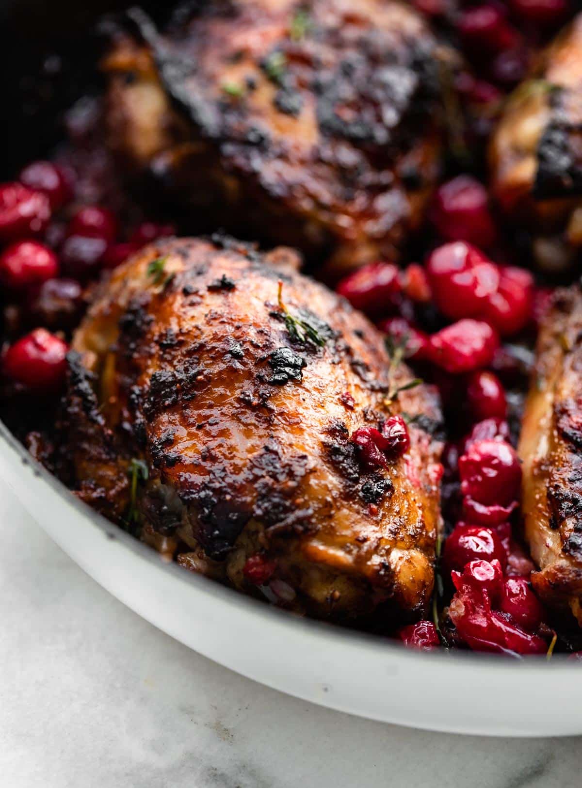 close up image of a piece of balsamic roasted cranberry chicken