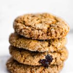 four vegan molasses cookies stacked on top of each other