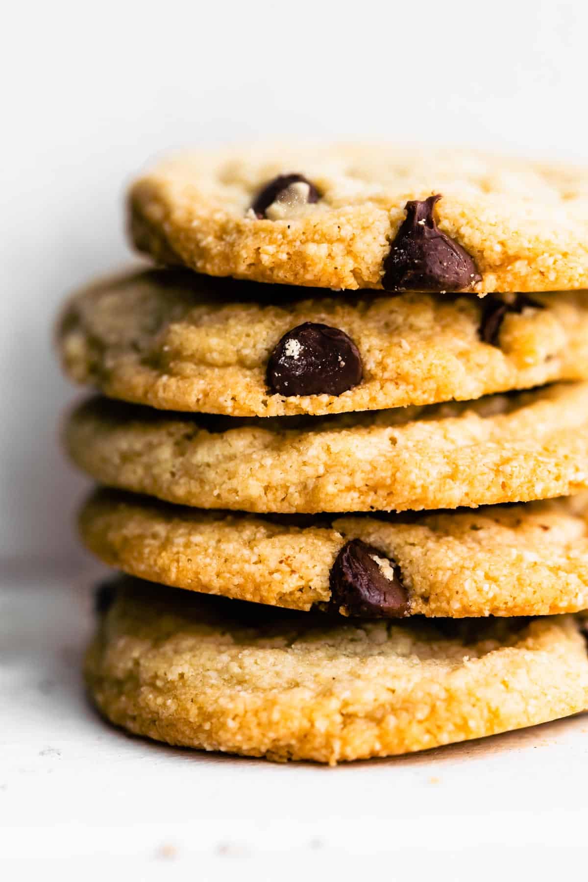 Vegan Chocolate Chip Cookies stacked on top of each other.