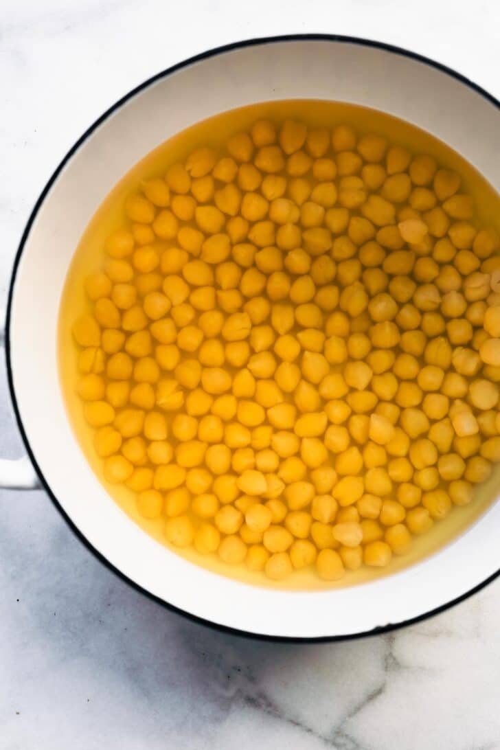 Overhead shot of Chickpeas soaking in a pot