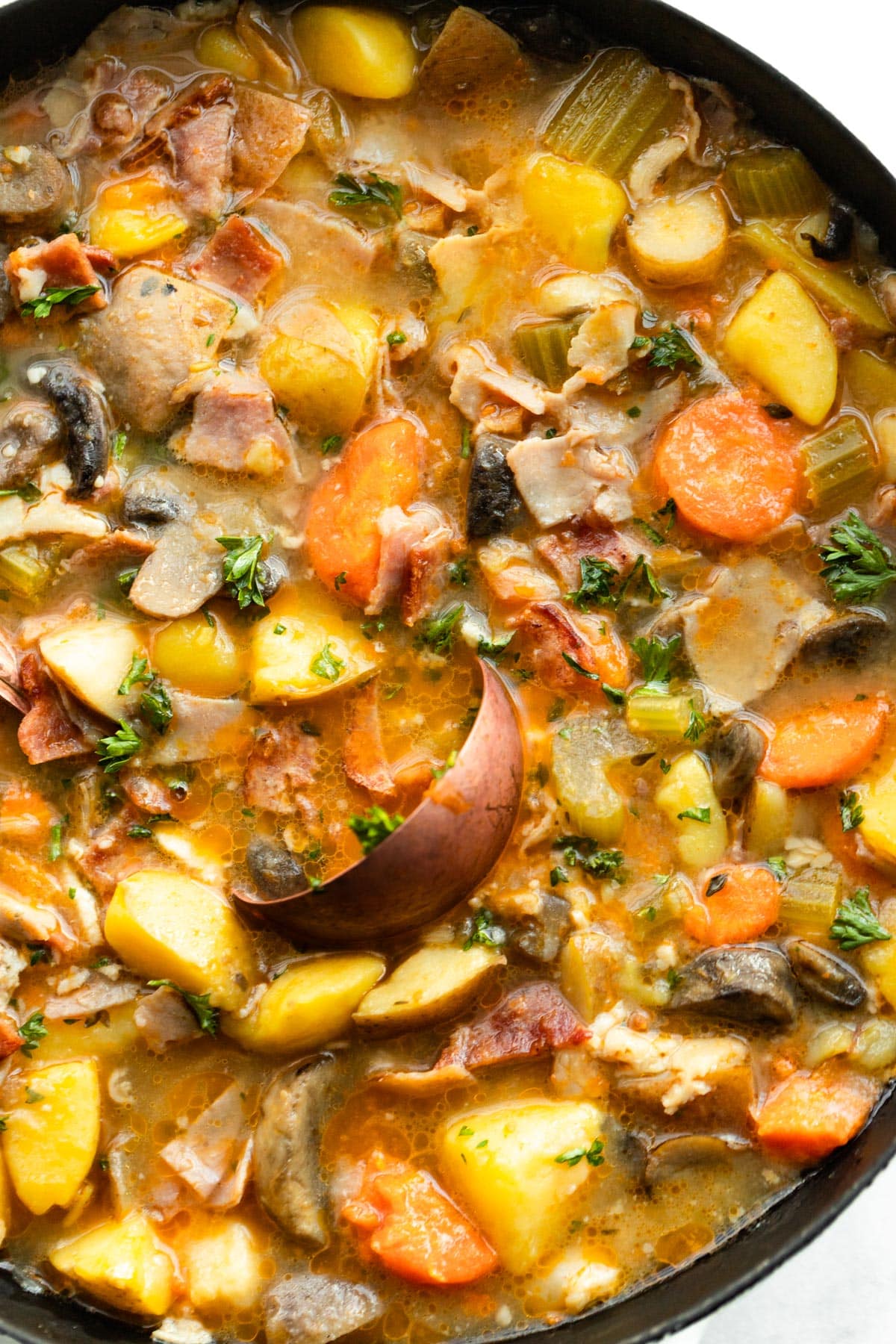 Close up of slow cooker vegetable soup with bacon