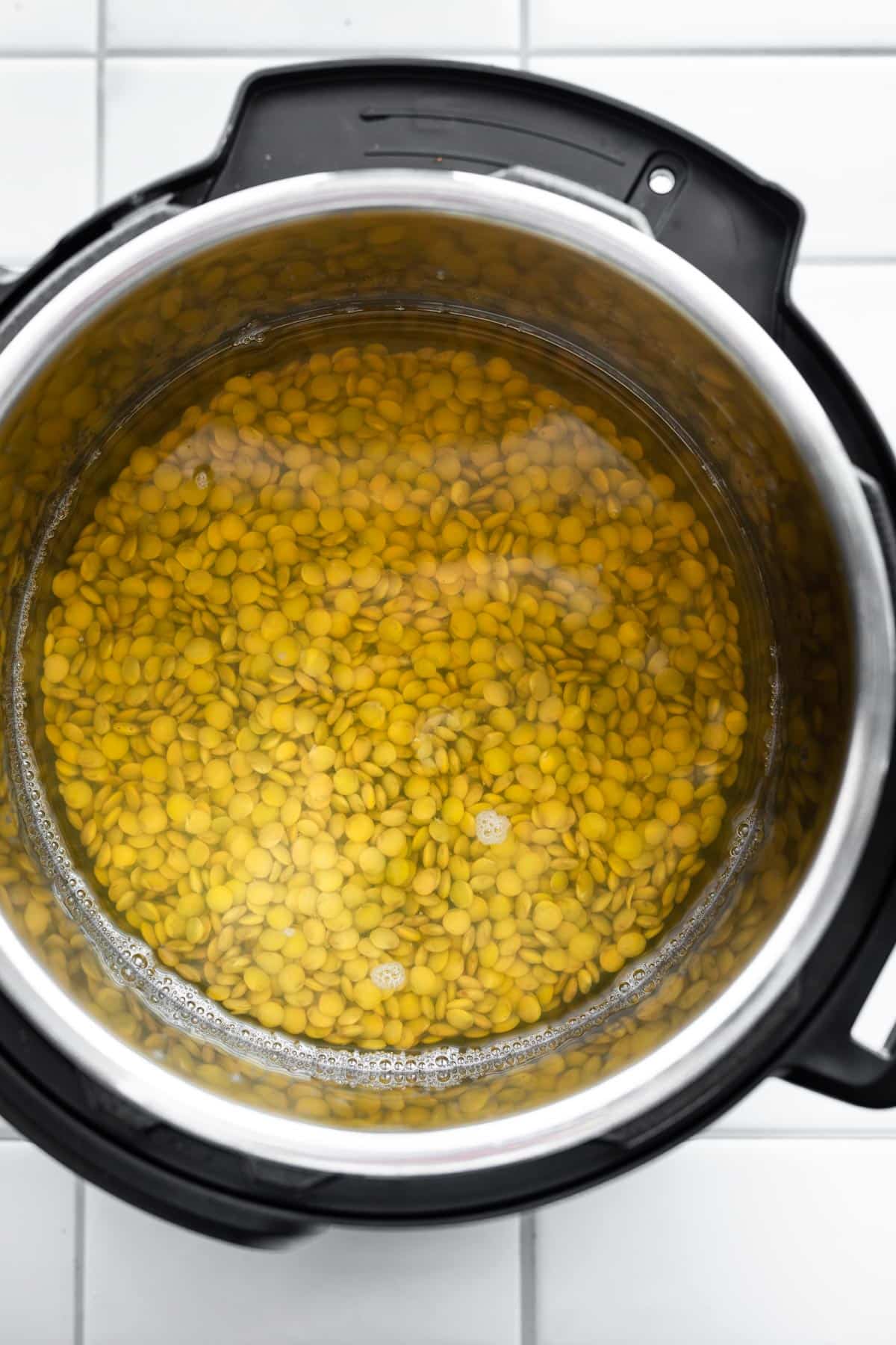 Overhead shot of Lentils soaking in an Instant Pot