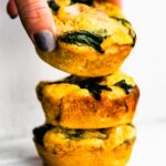 Three Fritatta Muffins being stacked on one another.