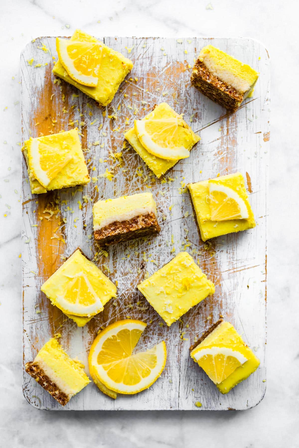 No Bake Lemon Cheesecake Bars squares scattered across a serving board.