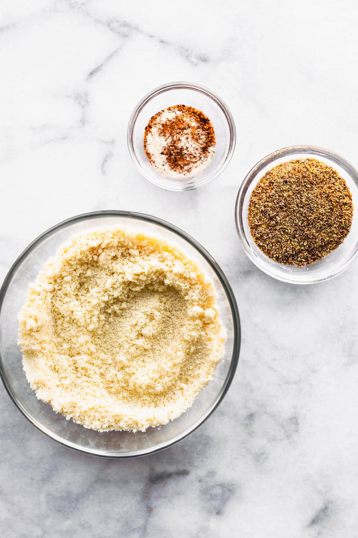 Bowls of almond flour, flax meal, and seasonings to make gluten-free panko.