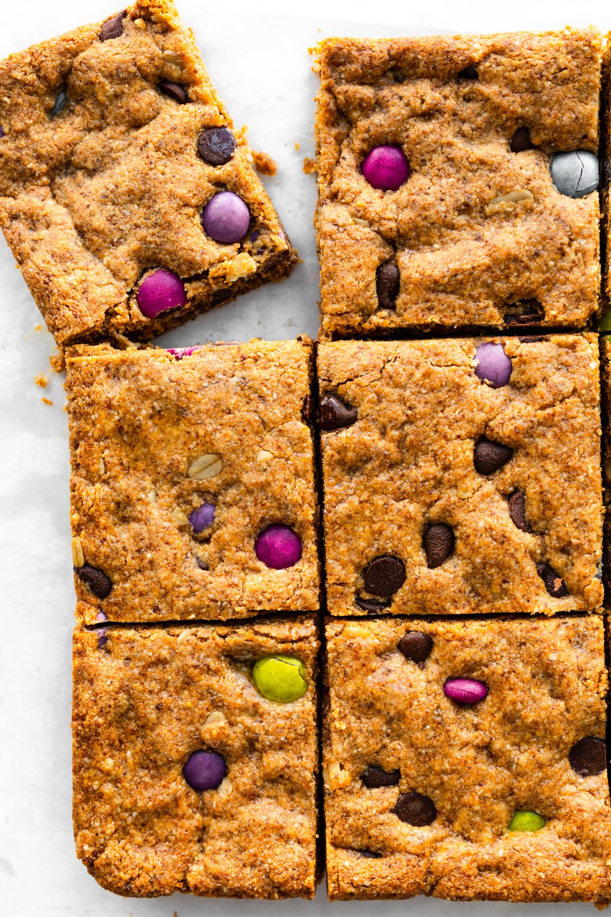 Six squares of gluten free monster cookie bars.