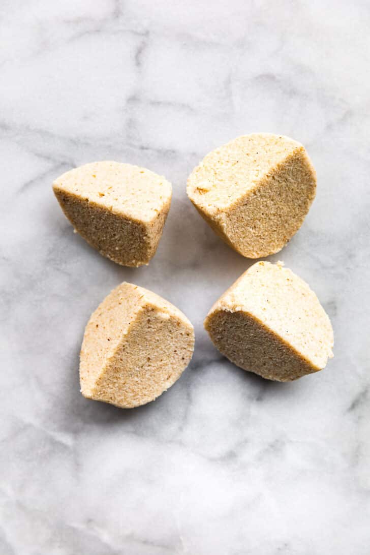 Almond flour tortilla dough split into four equal parts.