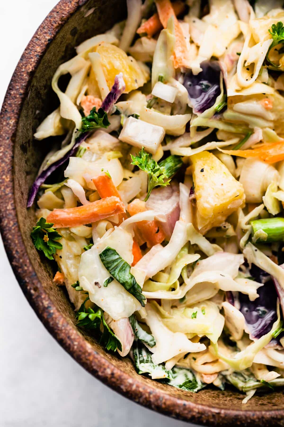 Overhead image of pineapple coleslaw made with vegan buttermilk.