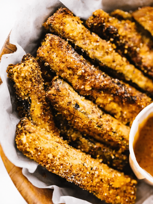 Gluten Free Air Fryer Zucchini Fries in a basket with dipping sauce.