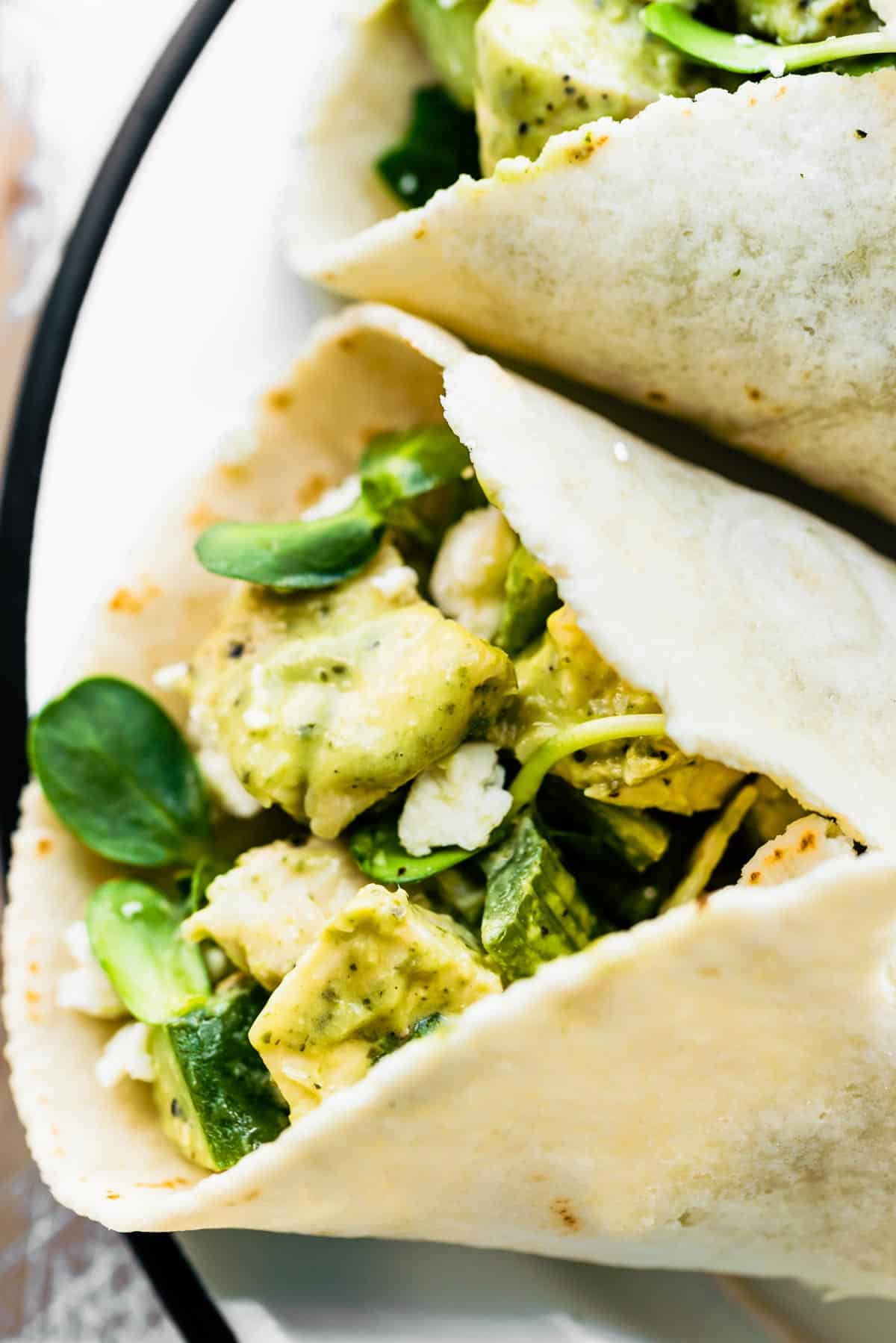 Close up image of the filling in a green goddess chicken salad wrap.