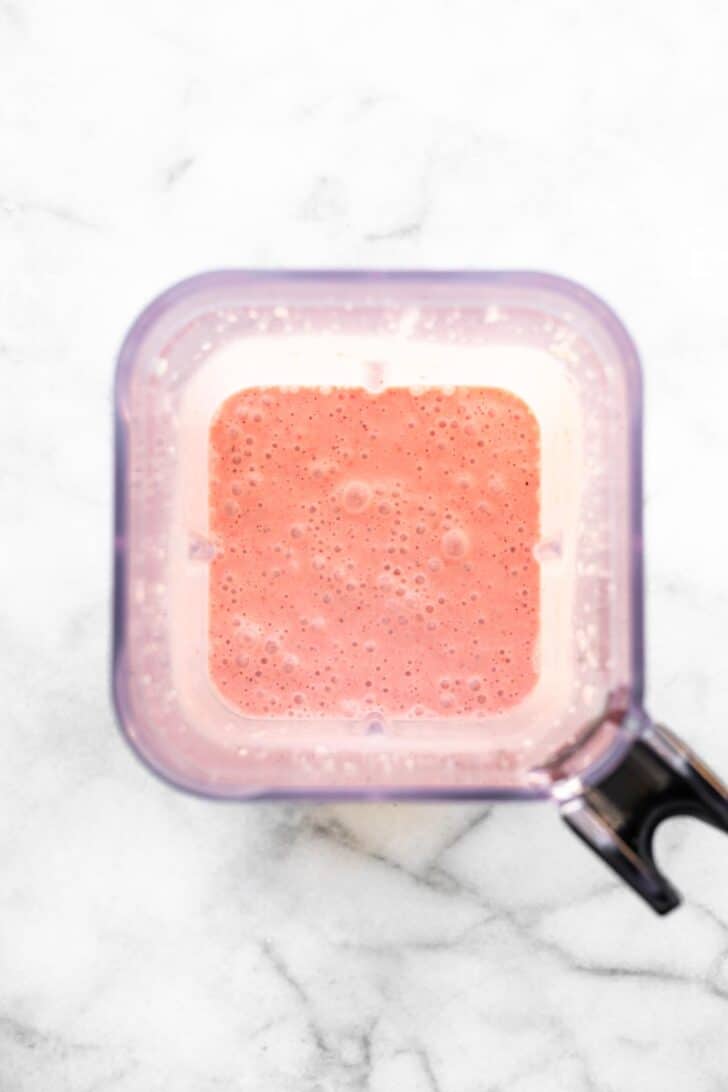 Frozen watermelon smoothie blended smooth in a blender.