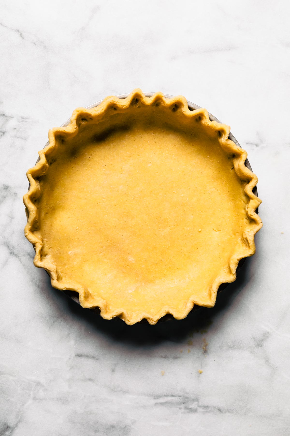 Overhead photo of a homemade unbaked gluten free pie crust.