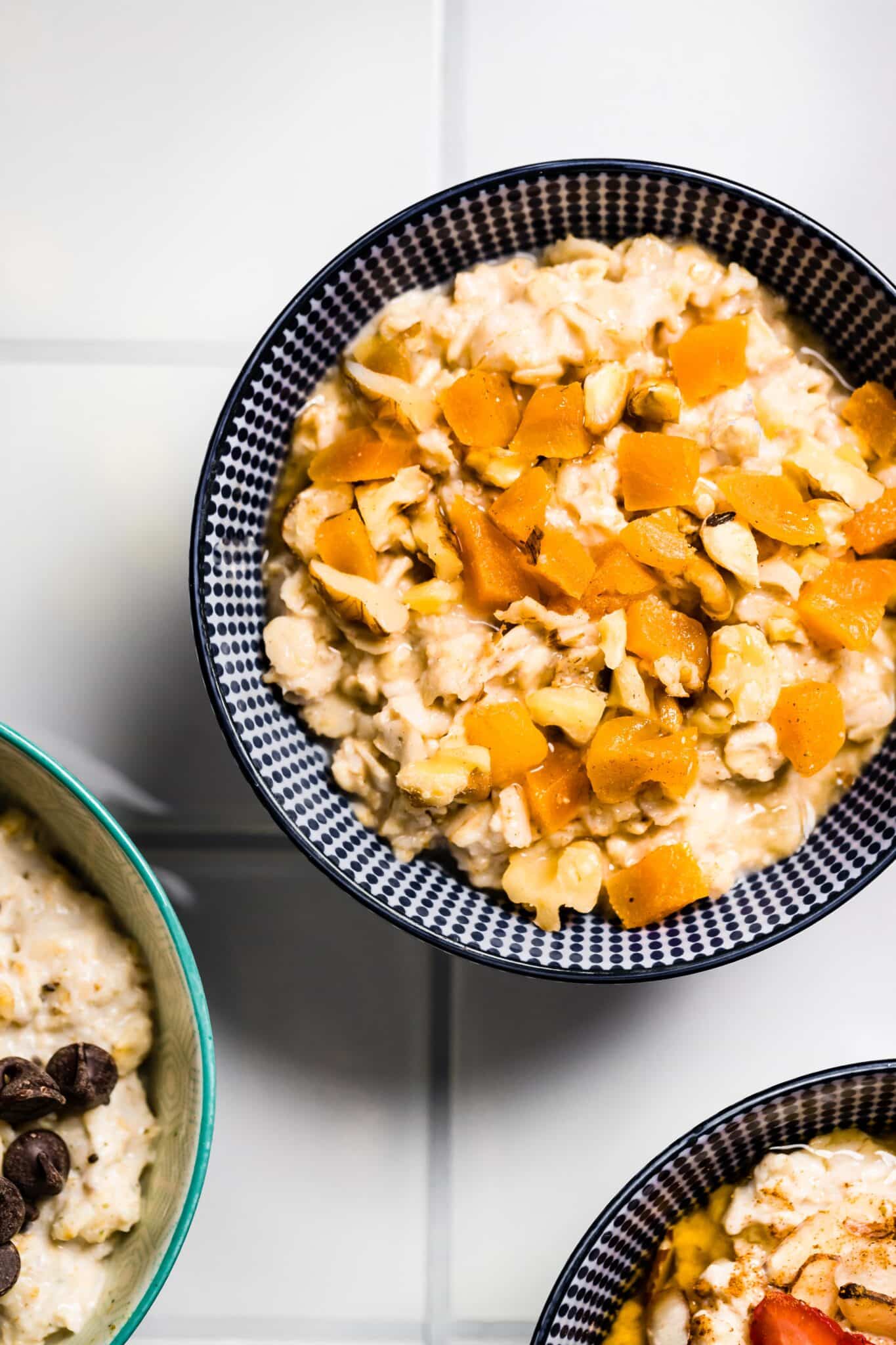 Overhead photo of high protein oatmeal topped with diced apricots.