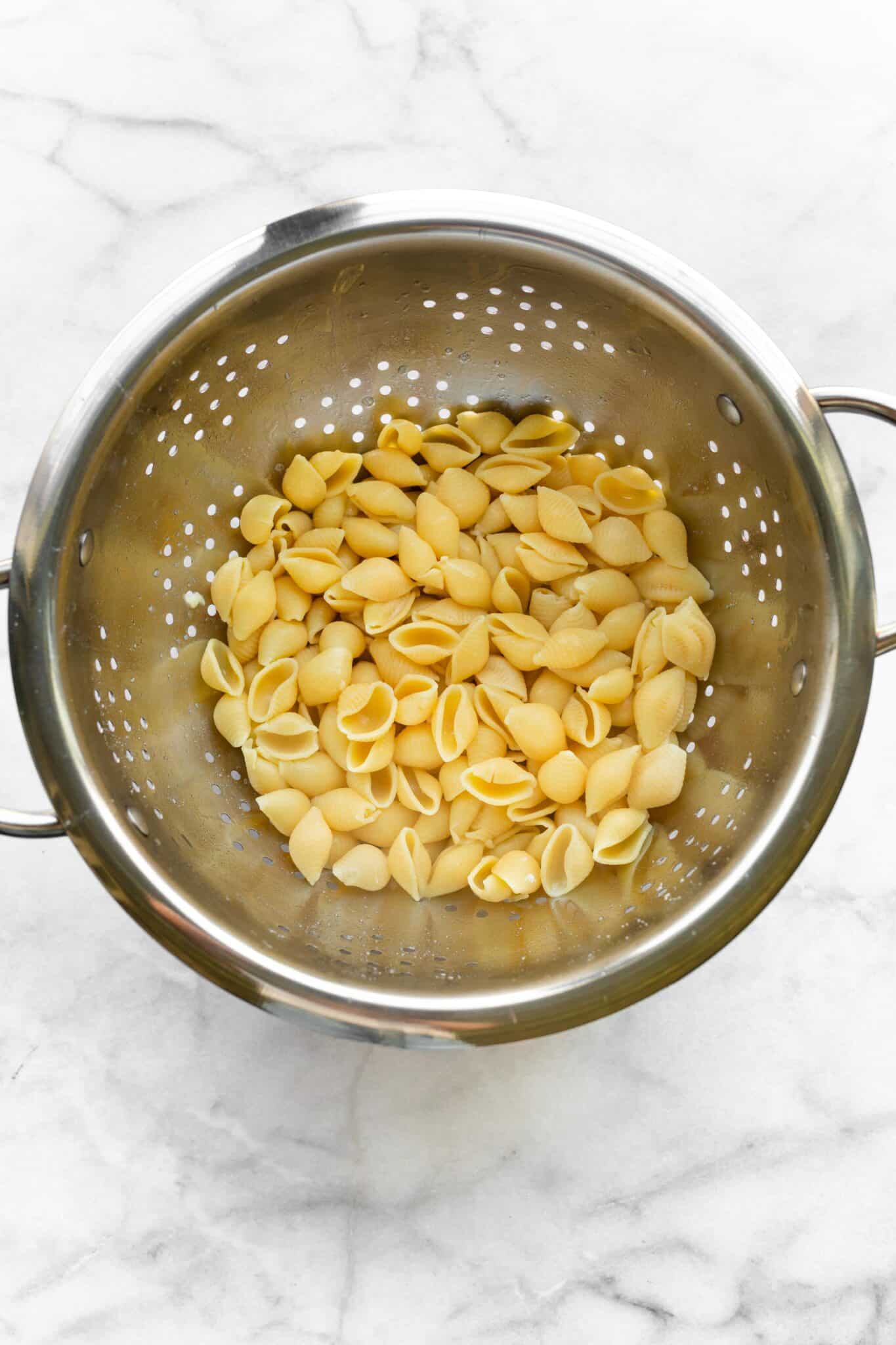 straining gluten free pasta in strainer
