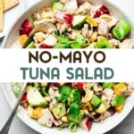 Finished tuna salad with chopped parsley, apples, celery, radishes, cashews, and tuna in a serving bowl with a serving spoon with a text overlay for Pinterest