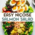 A salmon nicoise salad with salad greens, green beans, new potatoes, tomatoes, hard boiled eggs, olives, capers, salmon and herbs on an oval platter with a text overlay for Pinterest.