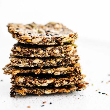 stack of homemade crackers made with 4 types of seeds